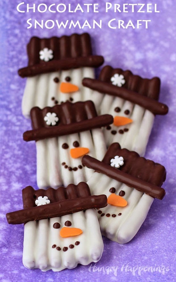 Chocolate Pretzel Snowman Craft - This winter, get crafty in the kitchen by making some sweet and salty snowmen pretzels. Each pretzel snowman couldn't be cuter with their orange carrot noses, snowflake topped hats, and sweet smiles.
