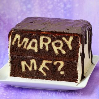 Surprise your sweetheart by proposing with this clever Marry Me? Reveal Cake. When your sweetie cuts into this cake your proposal will be revealed.