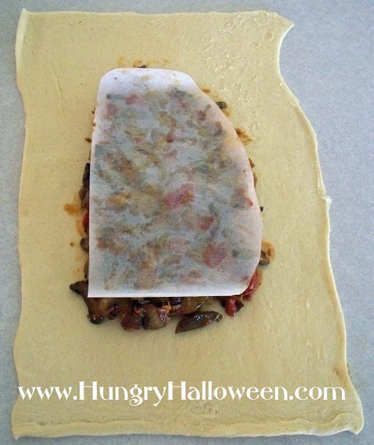 mushroom filling arranged into a lung-shaped over a Crescent Roll Dough Sheet. 