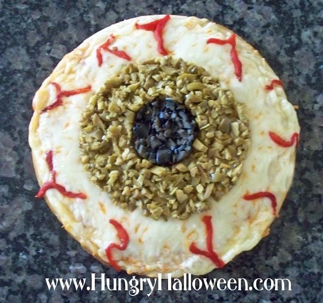 Looking for an appetizer to make to scare your friends? Try making one of these Halloween Appetizers Shaped Like Eyes... they're spooky and delicious!
