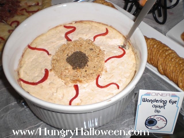 hot chicken dip decorated to look like an eyeball. 