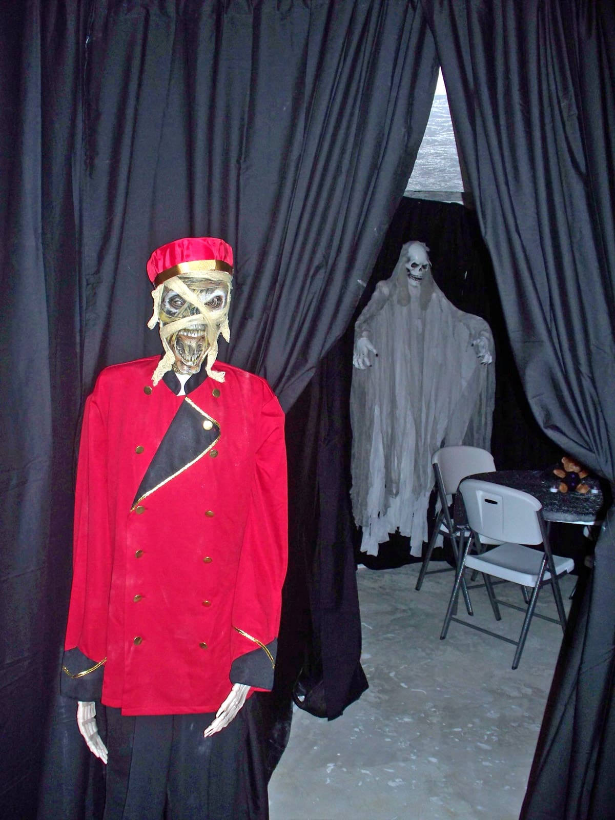 entrance to the Halloween movie theater with a zombie usher.