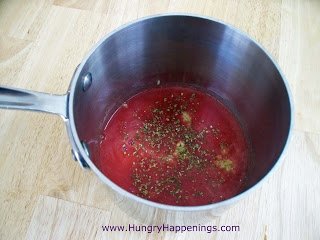 cooking tomato puree in saucepan