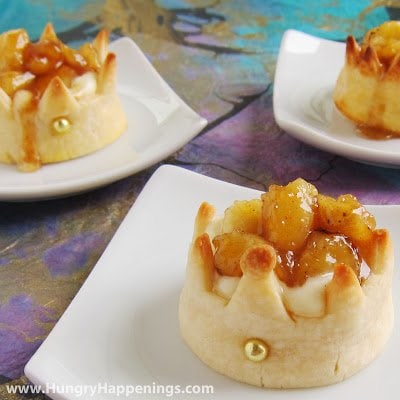 pie crust shaped into crowns filled with cheesecake mousse and caramelized bananas