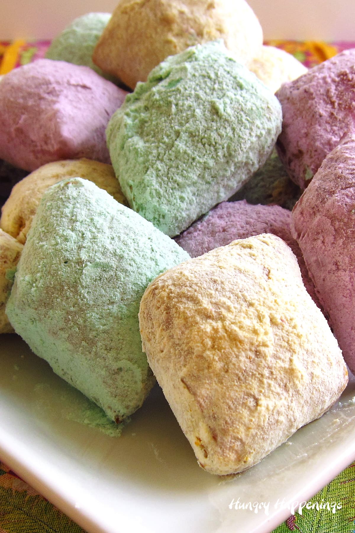 Mardi Gras dessert - diamon-shaped beignets dusted in colorful powdered sugar
