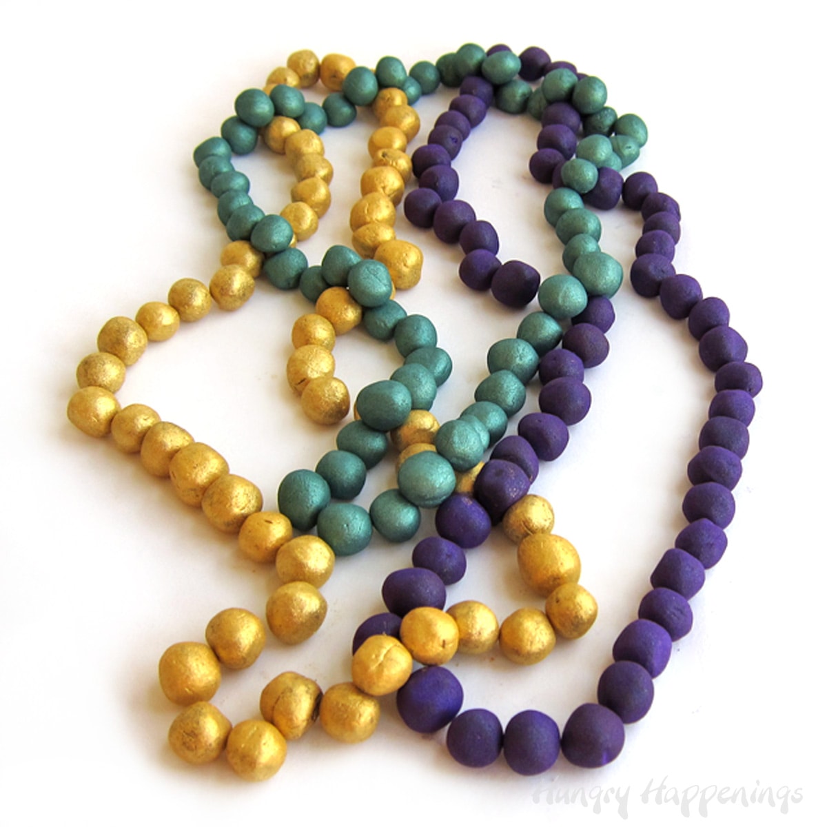 chocolate Mardi Gras beads dusted in gold, purple, and green