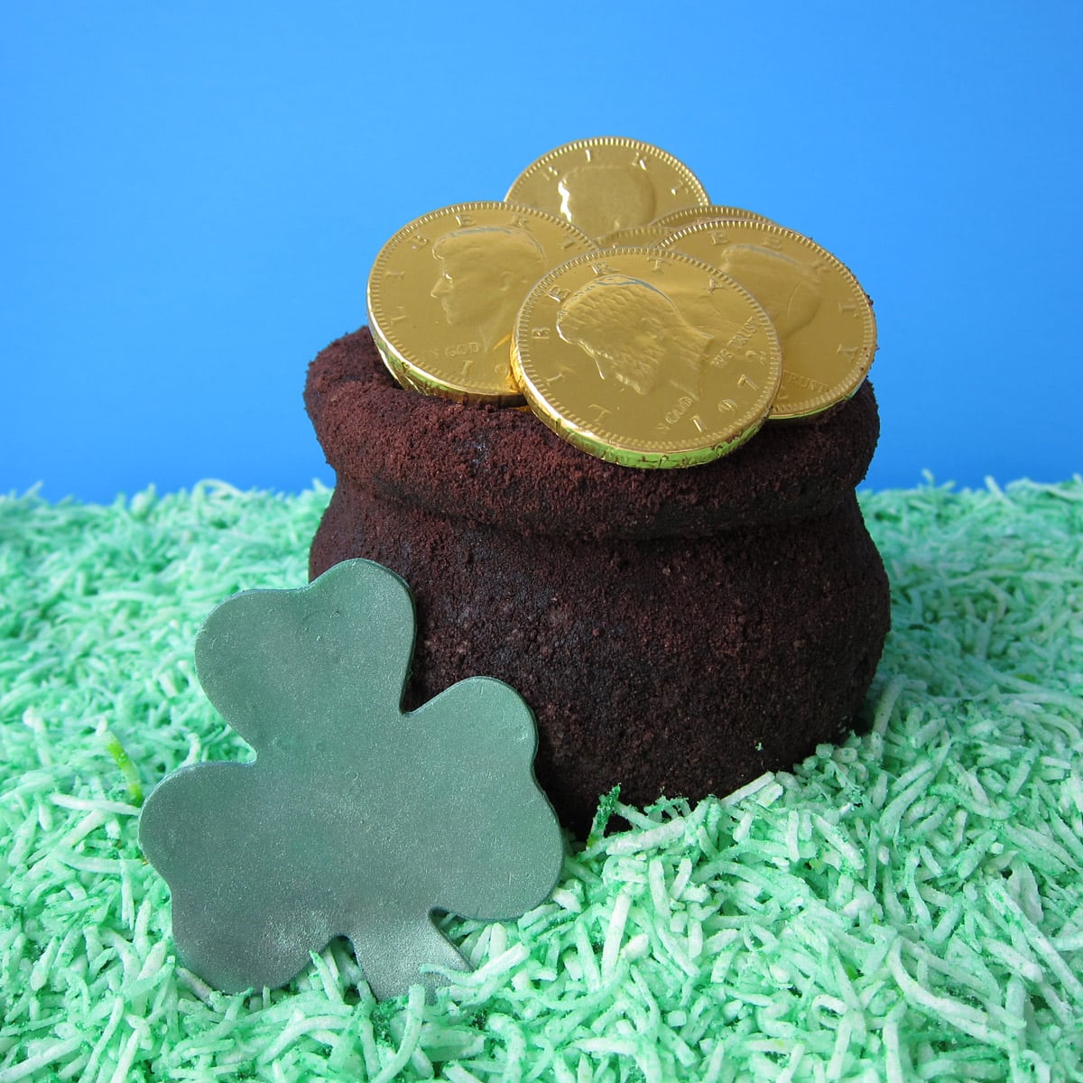 pot of gold OREO Cheese Ball filled with foil-wrapped gold coins.
