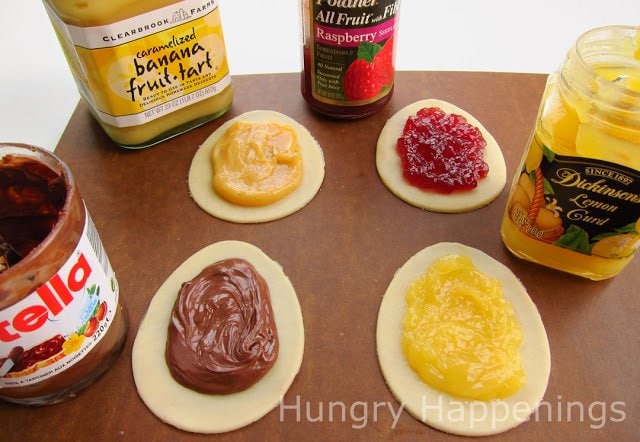 spread banana fruit-tart filling, raspberry jam, lemon curd, or Nutella over the egg-shaped pie dough cut-outs. 
