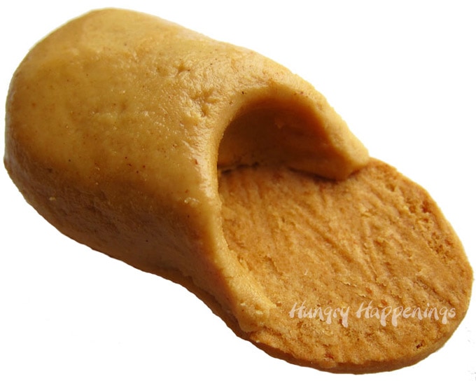 peanut butter fudge is used to create the top part of the Nutter Butter slipper cookies