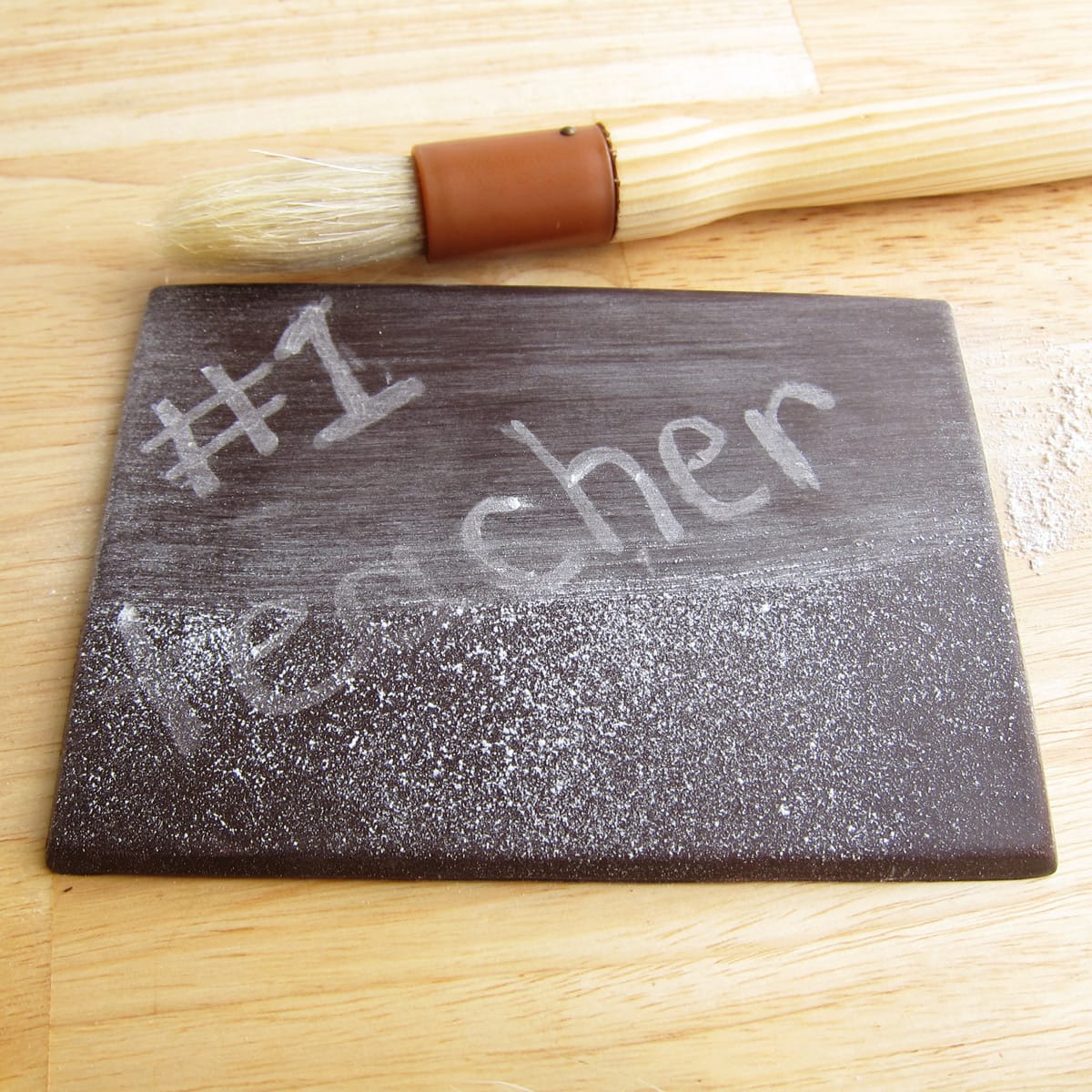 chocolate chalkboard dusted with powdered sugar. 