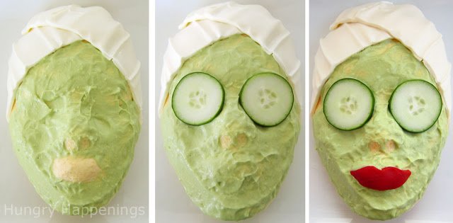 making a cheese ball that looks like a woman getting a facial with cucumbers over her eyes and red pepper lips. 