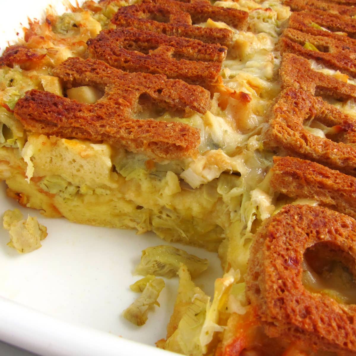 savory three cheese chicken and artichoke bread pudding topped with 