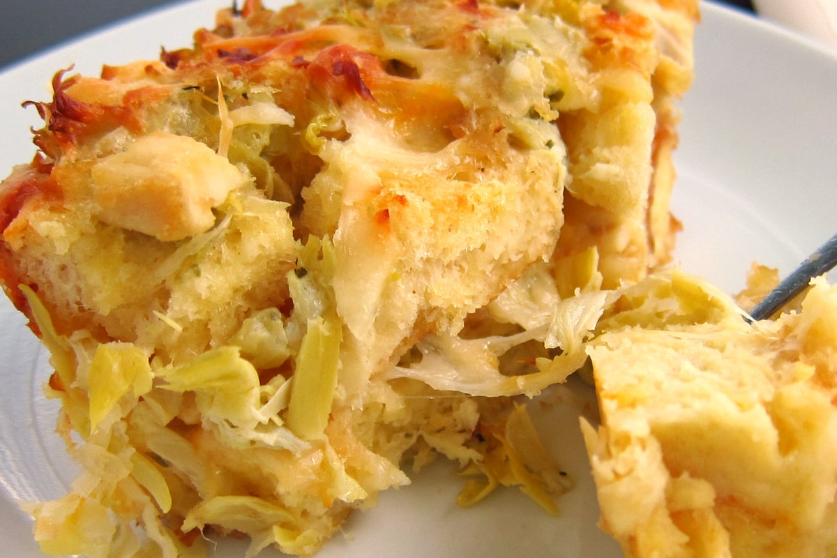 savory bread pudding filled with chicken, cheese, and artichokes