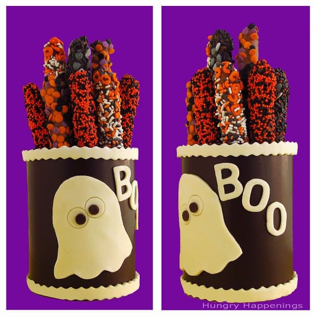 Chocolate Canister decorated with white modeling chocolate ghosts and filled with Halloween pretzel sticks. 
