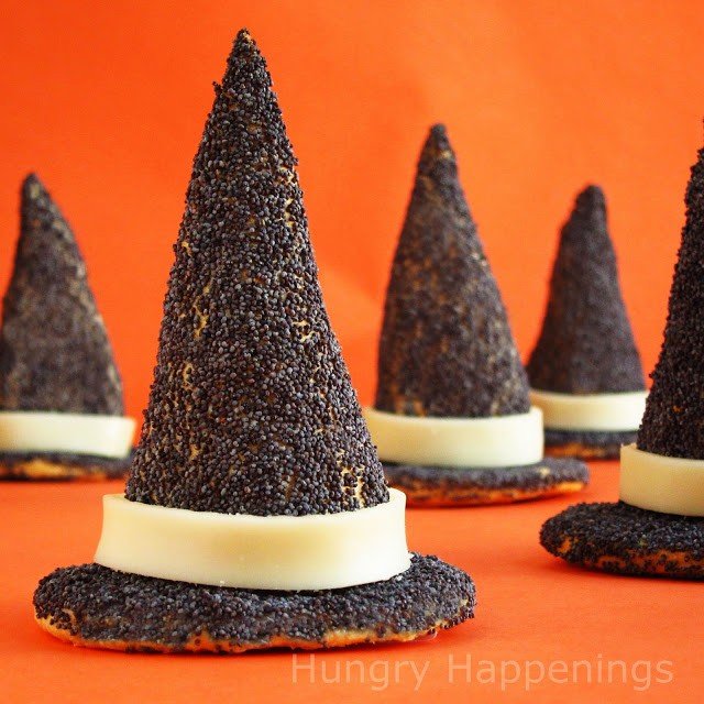 crescent roll witch hats covered in poppy seeds with a white hat band