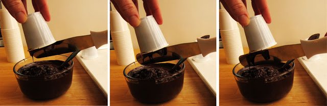 scraping chocolate off the bottom of the cup. 