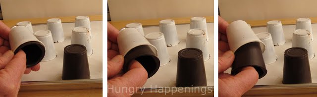 removing chocolate cups from a plastic cup