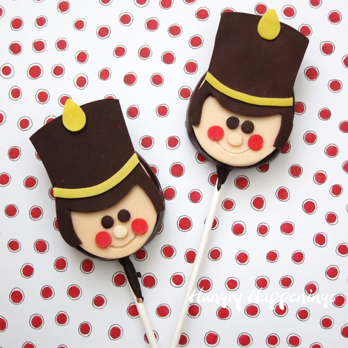 Chocolate peanut butter fudge filled lollipops topped with Toy Soldier modeling chocolate design. 