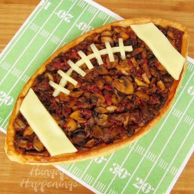 This Madeira Mushroom filled Football Tart is for all the mushroom lovers at the party. There can never be enough of them in a dish, and this appetizer proves it!