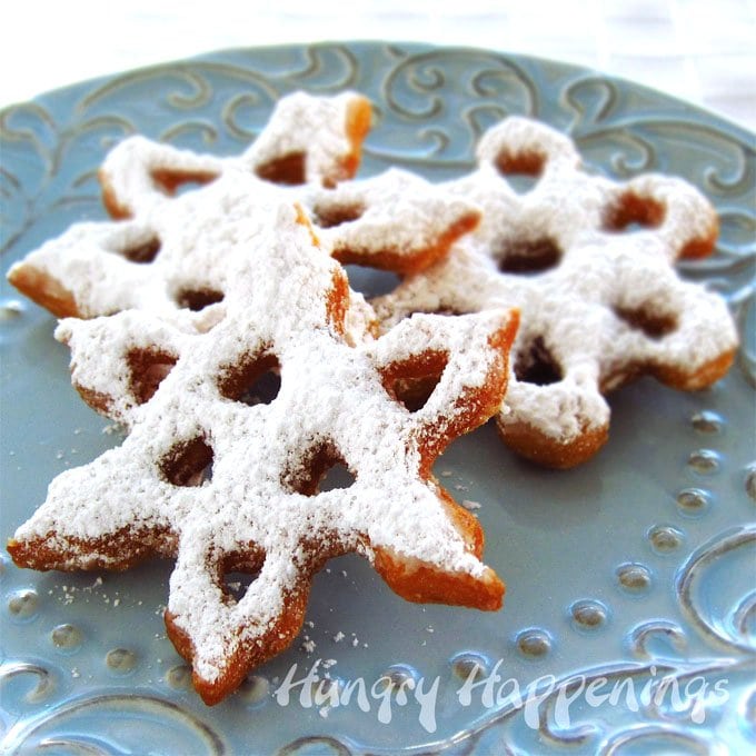 Turn store bought dough into beautiful Sweet Snowflake Doughnuts. They will warm and fill you up on a snowy winter's day and make a festive breakfast for Christmas morning.