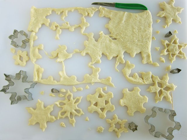 cut snowflakes out of crescent dough.