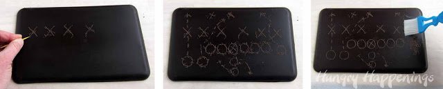 scratching Xs and Os into a chocolate chalkboard. 
