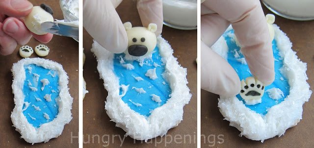 adding the white modeling chocolate polar bear to the ocean cookie using frosting. 