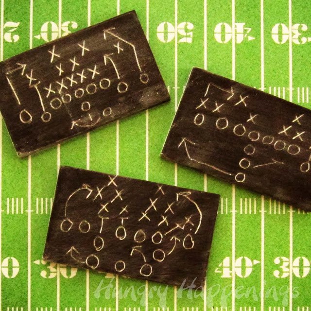 small game plan chocolate chalkboards on a football field background. 