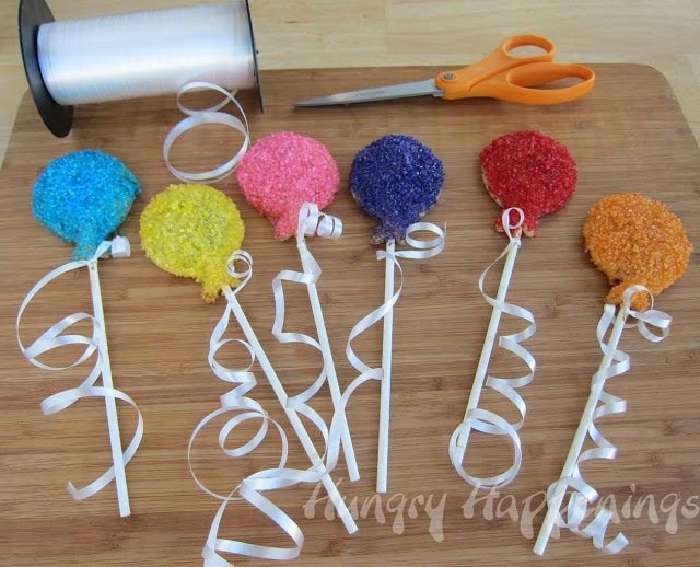 tie ribbons onto the birthday balloon breakfast pastry lollipops