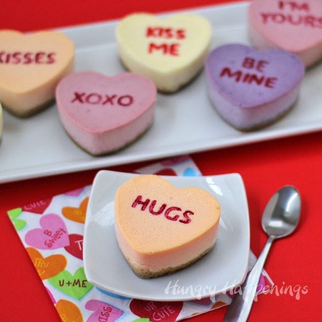 Naturally colored Conversation Heart Cheesecakes are flavored with raspberries, lemon, blackberries and orange.