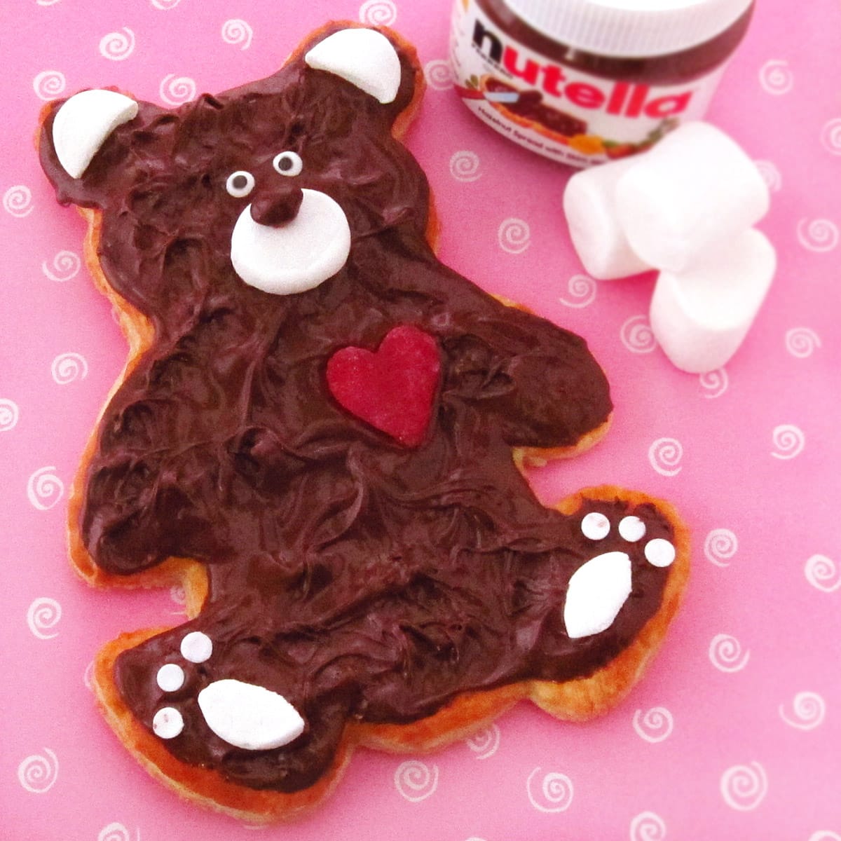 Nutella Tart Teddy Bear with marshmallow ears, snout, and paws, and a red candy heart and candy eyes