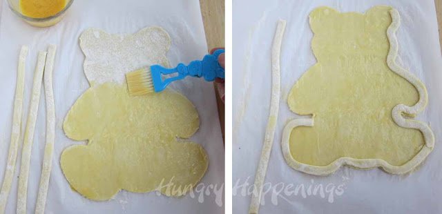 brushing egg wash over a teddy bear-shaped piece of puff pastry and adding a pastry border around the edge of the bear