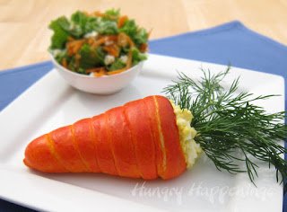 Are you having trouble getting your kids to eat vegetables? Try making these fun Carrot Shaped Veggie Pizzas, they're a great appetizer for your Easter Party and are healthy to eat!