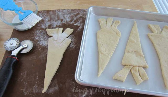 put carrot-shaped dough on a parchment paper-lined baking sheet. 
