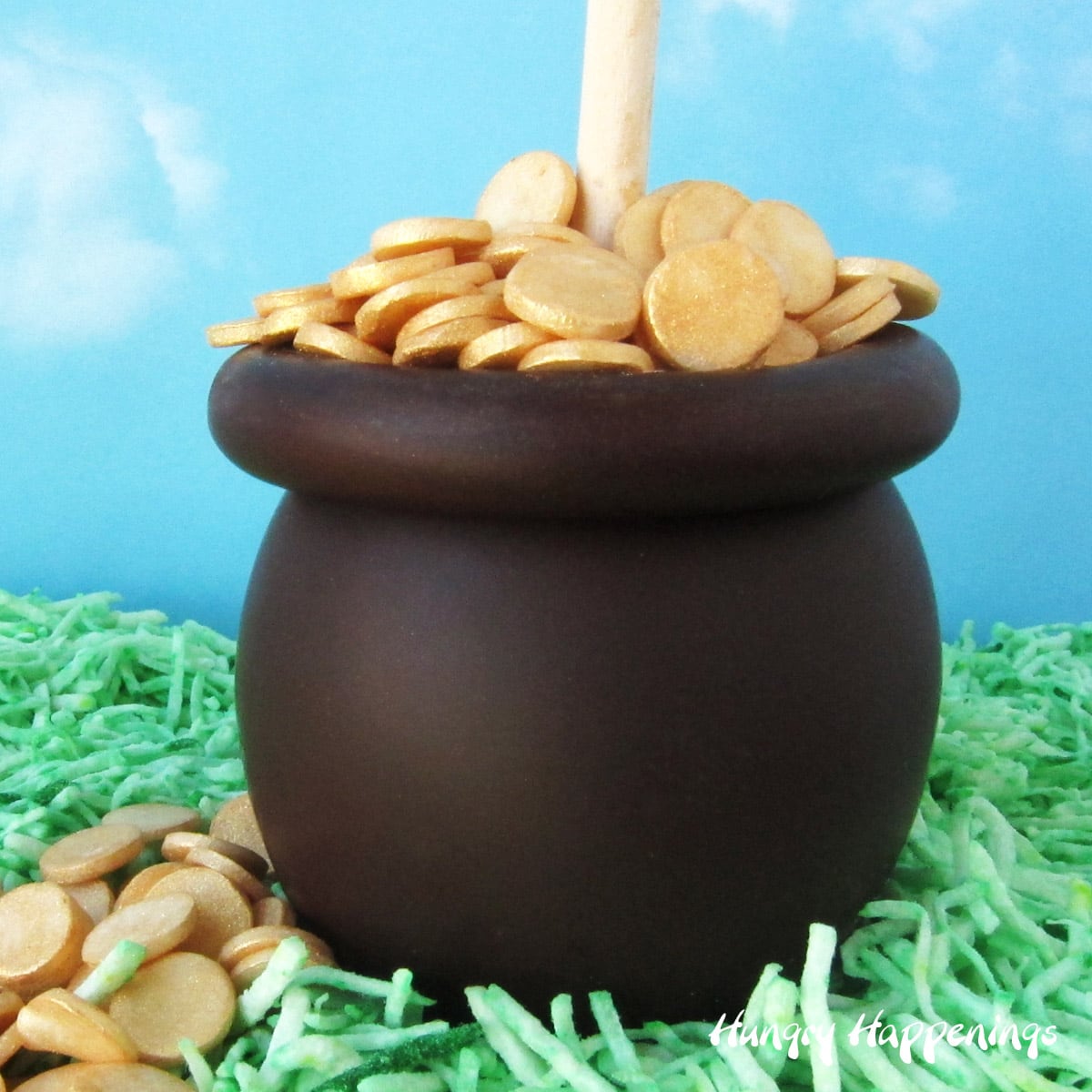 chocolate caramel apple pot of gold on green coconut grass with modeling chocolate gold coins