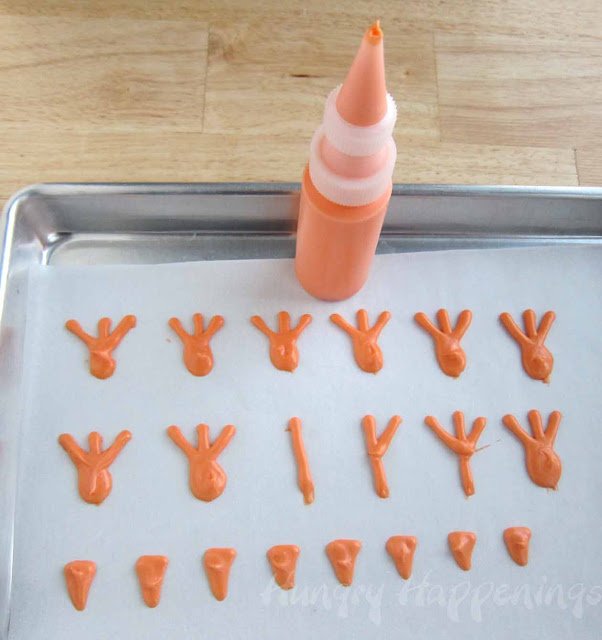 making orange candy chicken feet.