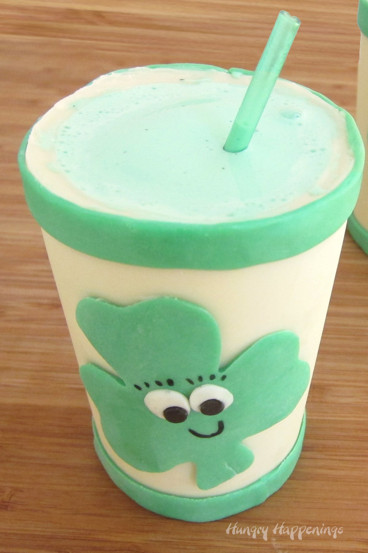 green St. Patrick's Day shamrock shakes in a smiling shamrock cup