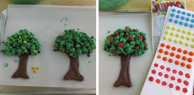 adding candy buttons to the fruit trees