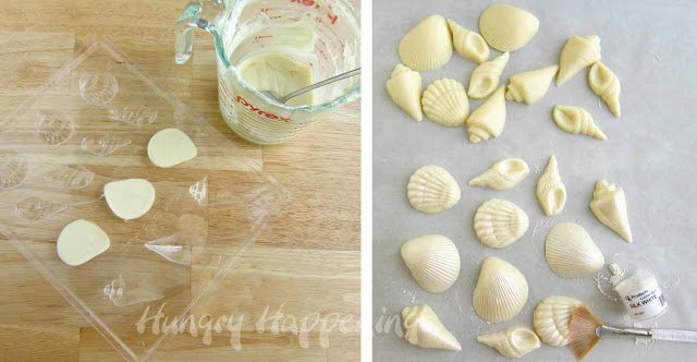 white chocolate sea shells brushed with white luster dust.  