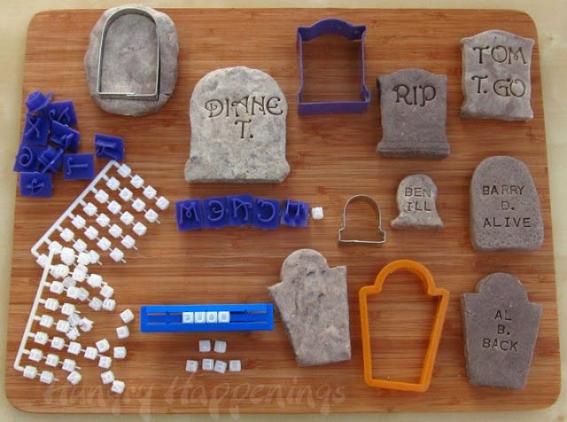cutting out fudge tombstones and imprinting them with alphabet stamps. 