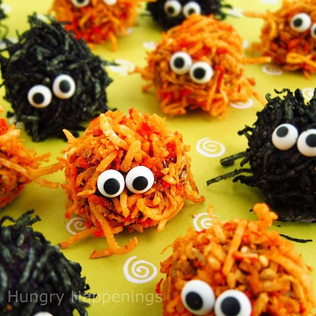 orange and black cake ball monsters covered in colored coconut. 