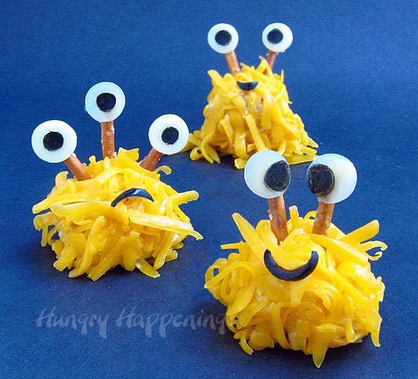 cheese ball monsters on a blue background. 