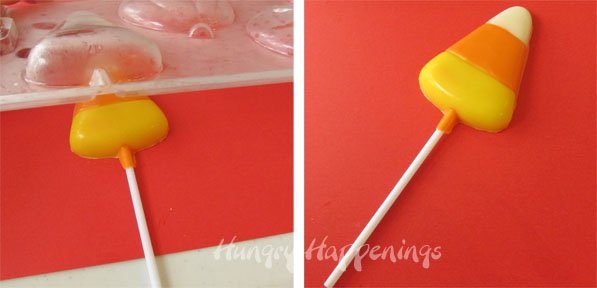 removing a candy corn lollipop from a mold. 