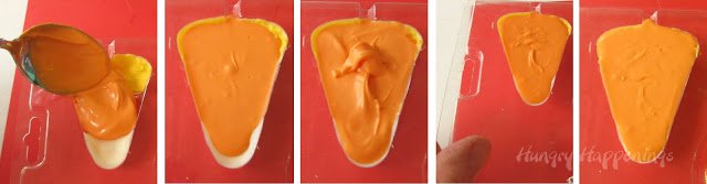 filling a candy corn candy mold with orange candy melts. 