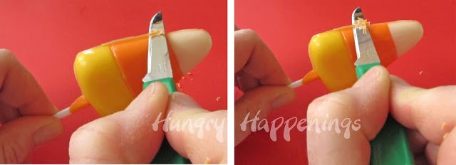 cutting the excess chocolate off the candy corn lollipop. 