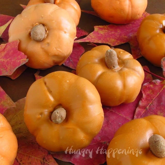 chocolate pumpkins with chocolate caramel filling coated in orange candy melts. 