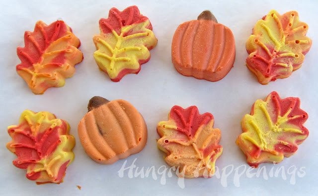 cheesecake leaves and pumpkins on a piece of parchment paper. 