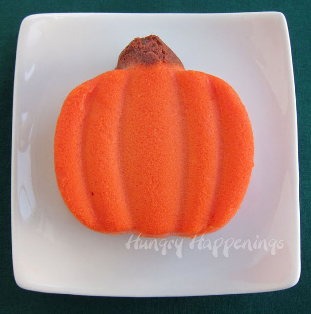 single pumpkin cheesecake on a square plate. 