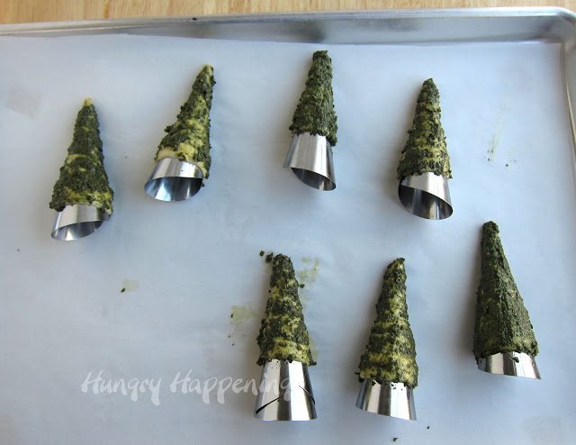 Brush crescent roll dough with green pesto to make Christmas Tree Rolls.