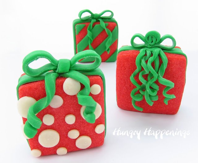 Candy Filled Christmas Present Cookies decorated with red and white modeling chocolate. 